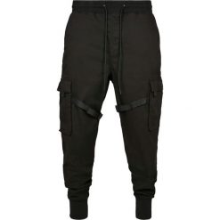 Spodnie Urban Classics tactical. Czarne spodnie materiałowe męskie Urban Classics, bez wzorów, z bawełny. Za 303.00 zł.