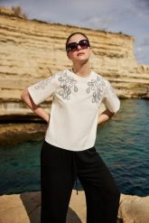 T-shirt z bawełny biały. Białe t-shirty damskie MOODO, l, bez wzorów, z bawełny, bez kołnierzyka. Za 59.99 zł.